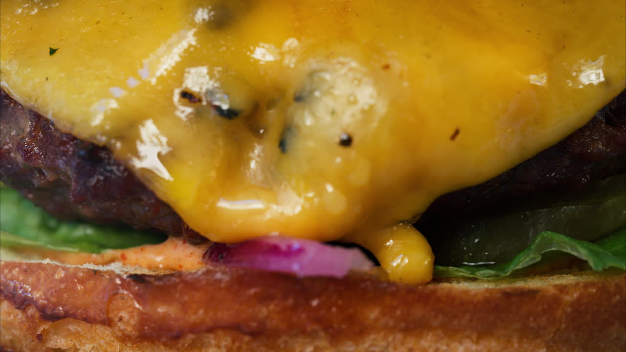 Close up of a big hamburger on a table at a restaurant