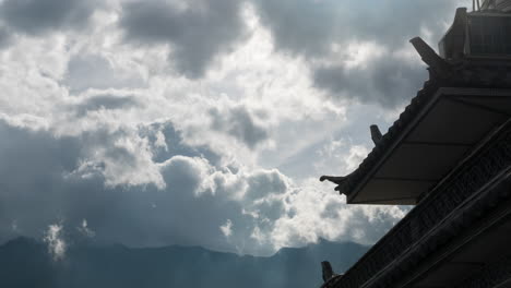 dramatic cloud time lapse over traditional chinese rooftop architecture