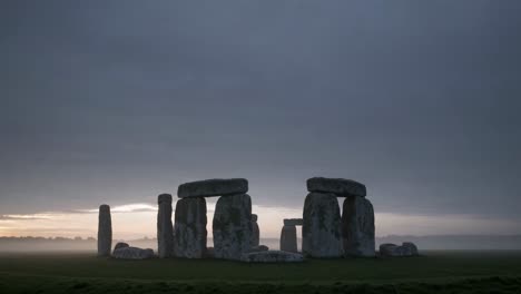 stonehenge at sunrise in a misty morning