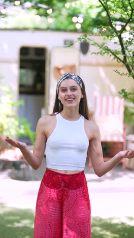 young woman smiling outdoors