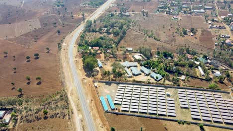 Jib-down-of-solar-panel-farm-in-rural-Africa--Sdg-green-renewal-energy--Solar-panel-cell-photovoltaic-farm