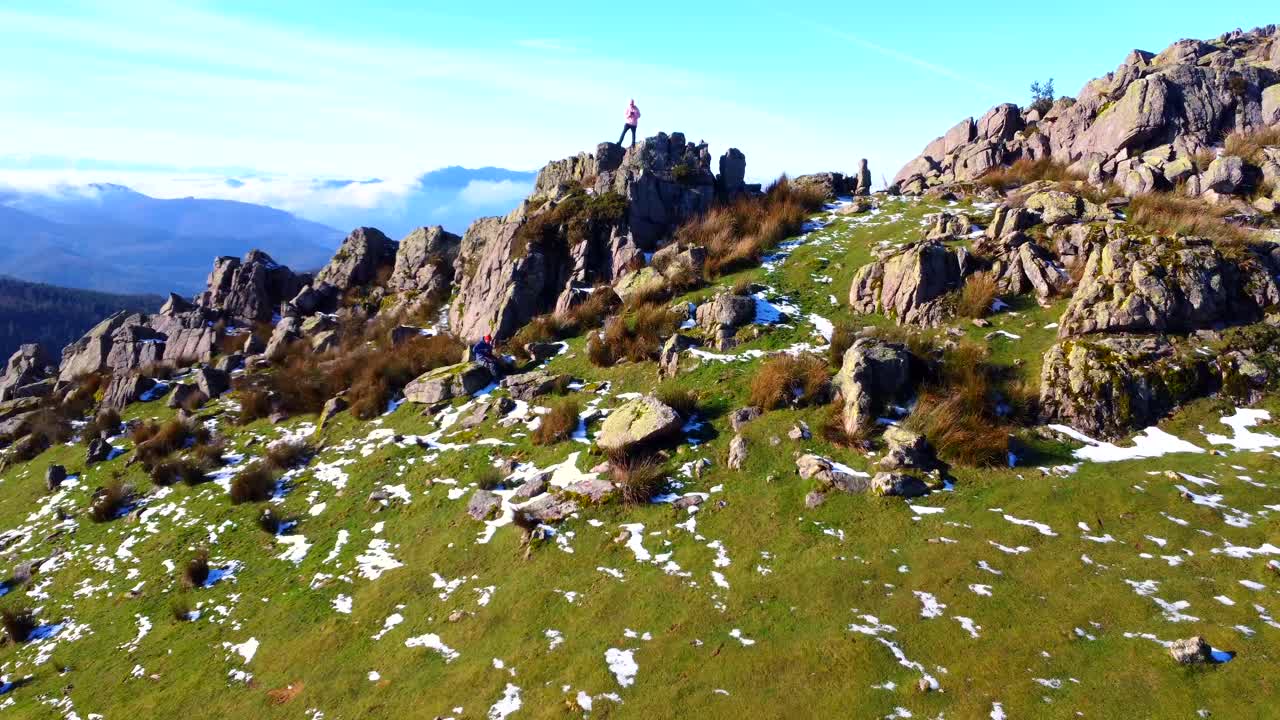 Panoramic Mountain Views with Hikers