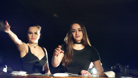 beautiful girls throwing money in the air, enjoying wealth and prosperity. young women sell drugs.