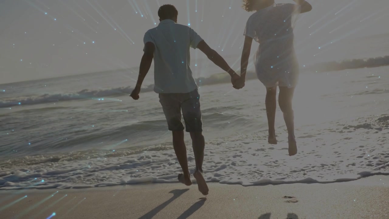 Woman and man holding hands, starting jogging into surf, travel ad overlaying streaks, particles