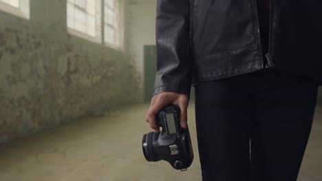 fashionable young man in an abandoned warehouse