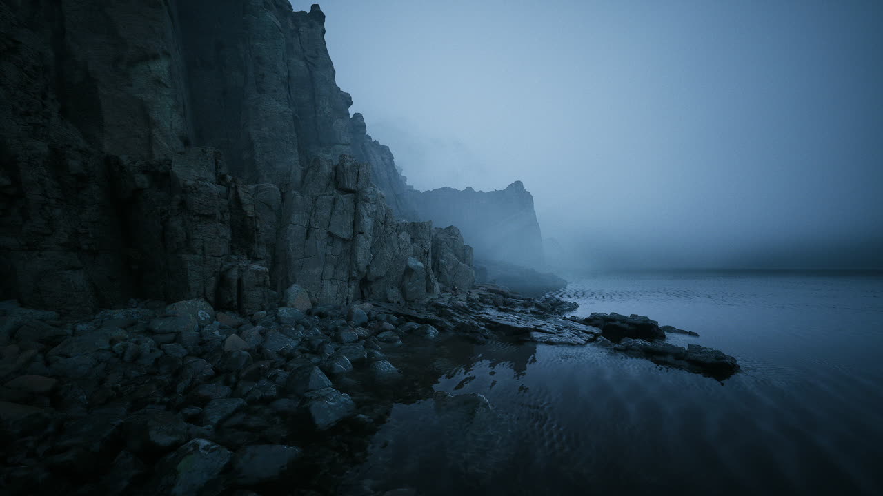 Misty coastal landscape with rocky cliffs and calm waters at twilight