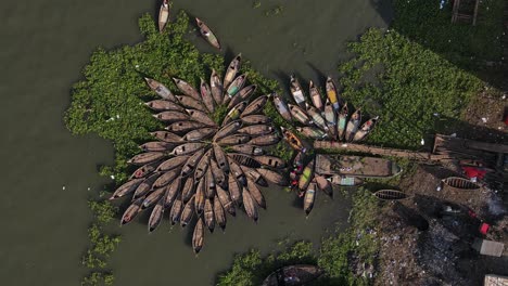 bangladesh: small wooden boats are arranged in rows for passenger river crossing on the buriganga at dhaka