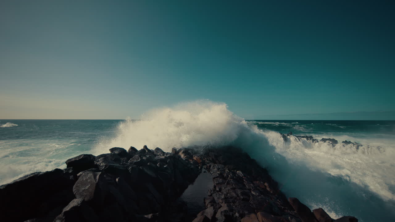 Powerful Waves Crashing on Rocky Coastline