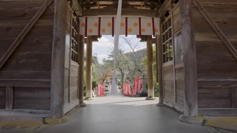 temple gate leading to kinosaki onsen, slow motion establishing shot