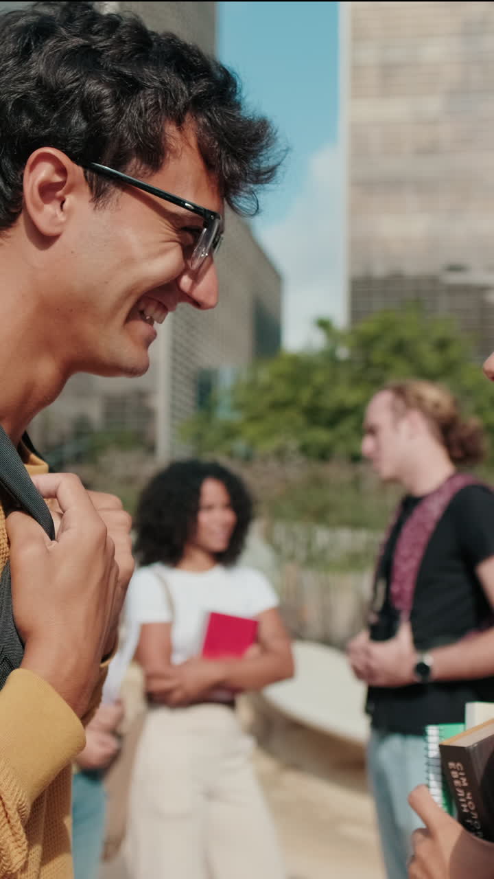 Side view of millenial friends, European male and female students, young couple