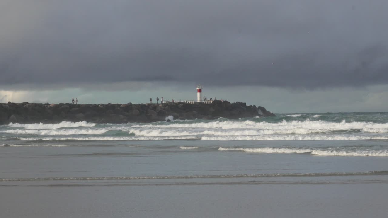 Lighthouse Spit Gold Coast Australia, ocean waves, cloudy storm clouds