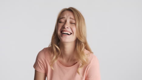 caucasian woman winking and fooling around on camera.