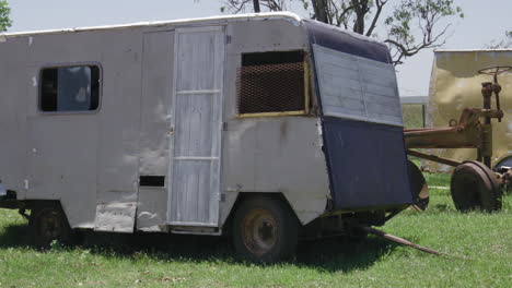 close up pan right shot of abandoned vehicles on roadside near saladas, argentina