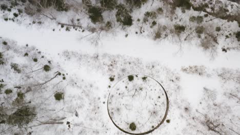 Top-down-aerial-view-flying-over-Katahdin-Ironworks-Winter-in-Maine