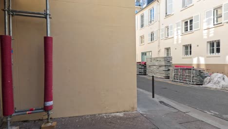 a quiet street with construction materials