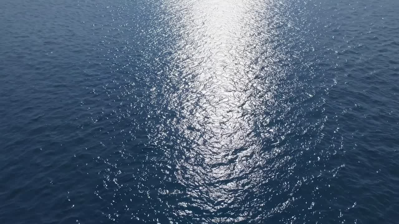 Bright Sun Reflection on Calm Blue Sea Water