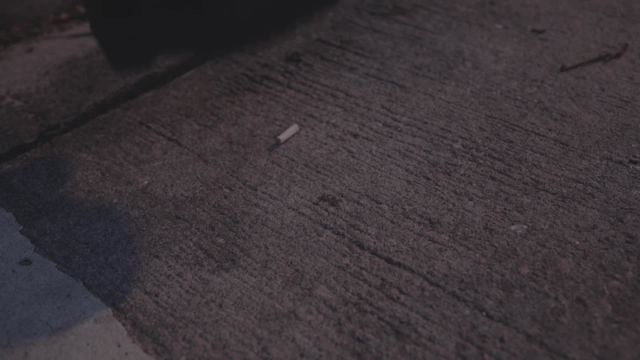 Cigarette Butt on Concrete