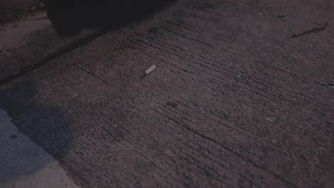 cigarette butt on concrete