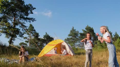 children spend summer vacations in a tent camp children rest in the woods in a tent summer vacation in a tent camp