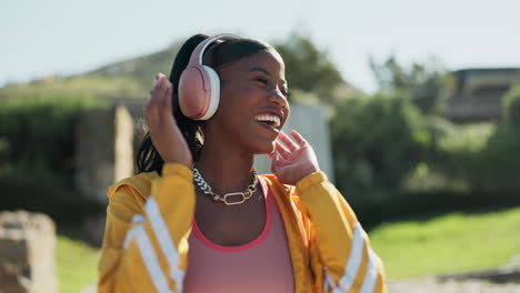 black woman, dancing and fashion with headphones