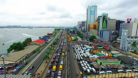 Victoria-Island,-Lagos,-Nigeria-along-the-coastline---aerial-flyover