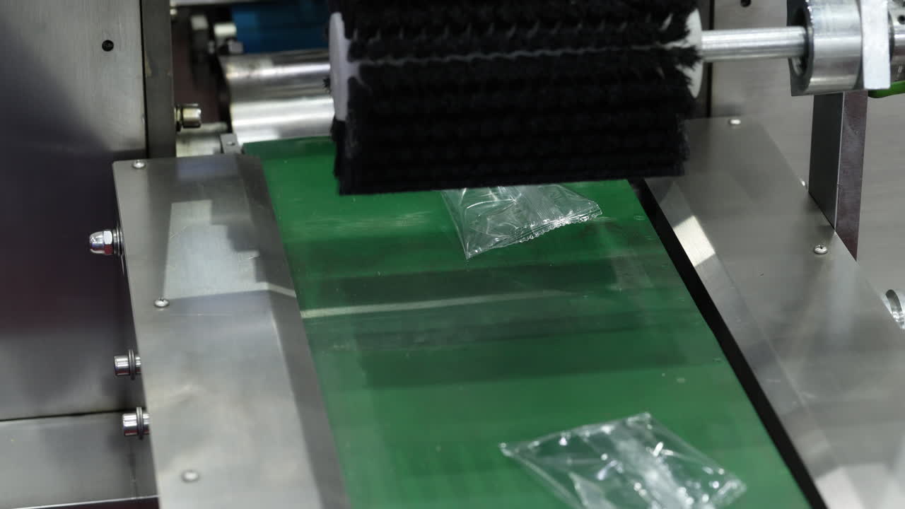 Automated Packaging Process with Plastic Bags on Conveyor Belt