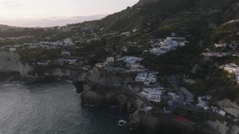 houses on seaside cliffs on italian island of ischia, aerial pull-out