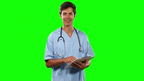 Front-view-of-doctor-writing-with-green-screen