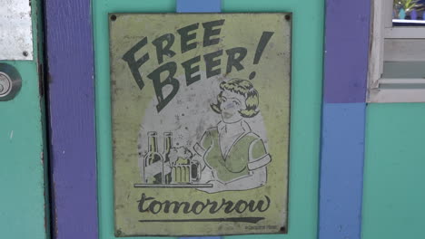 a sign informs people that free beer will be served tomorrow