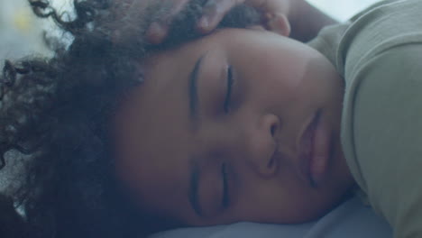 dad taking nap with little son