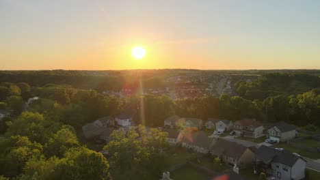 aerial shot of a beautiful suburban neighborhood in america during a beautiful sunset