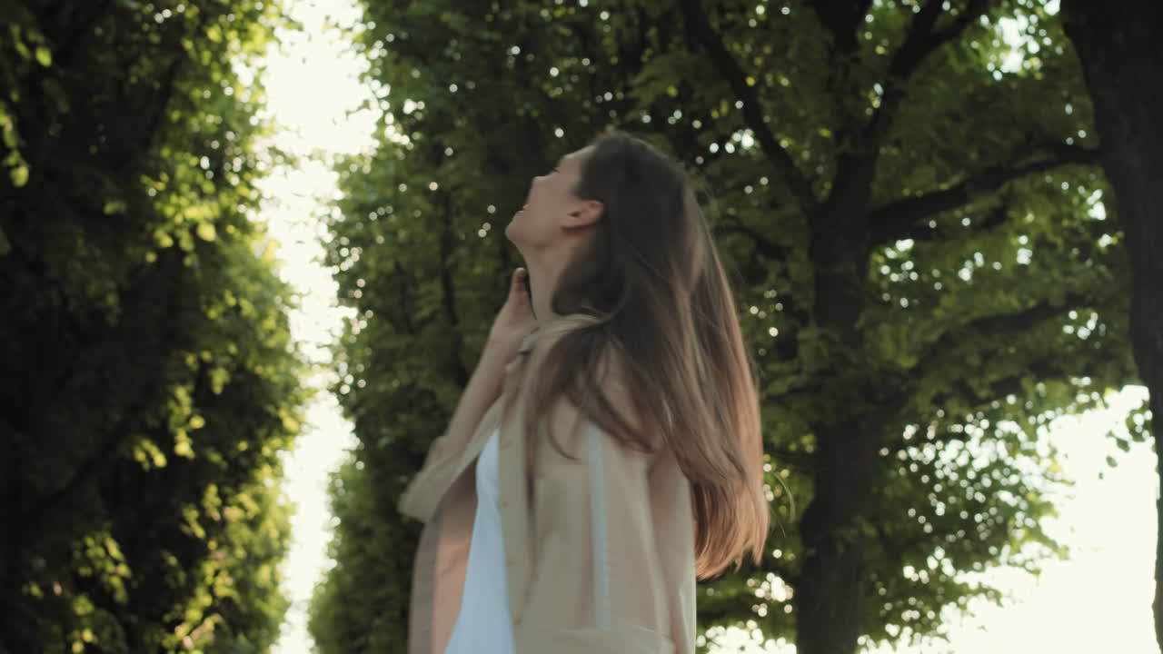 Woman Phone Calling in Tree Alley