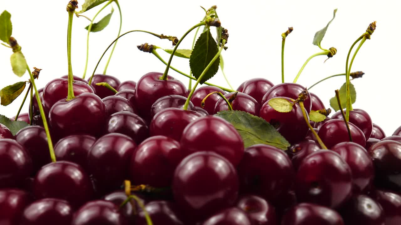 Ripe red cherries on the white background