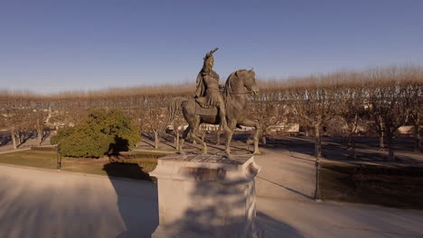 statue of louis xiv on horseback montpellier france aerial drone flight. sunny