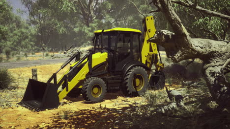 heavy machinery clears land under bright sunlight in rugged terrain