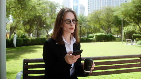 Woman-sitting-on-the-bench-of-a-park