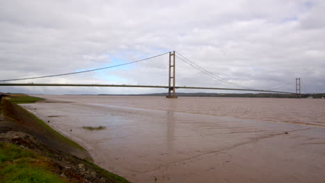 extra wide shot of the humber bridge showing exposed mud flats on the humber estuary