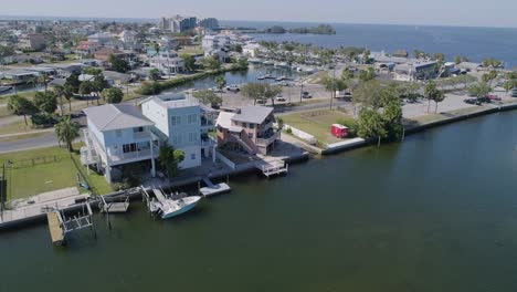 4k drone video of waterfront homes on canals in hudson beach on the gulf of mexico in florida