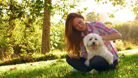 woman petting dog on her lap