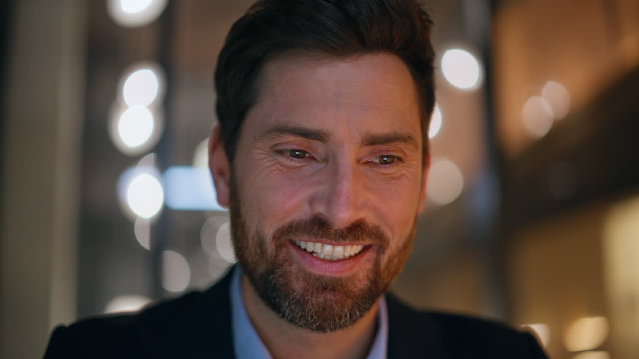Smiling entrepreneur satisfied project startup sitting night office closeup