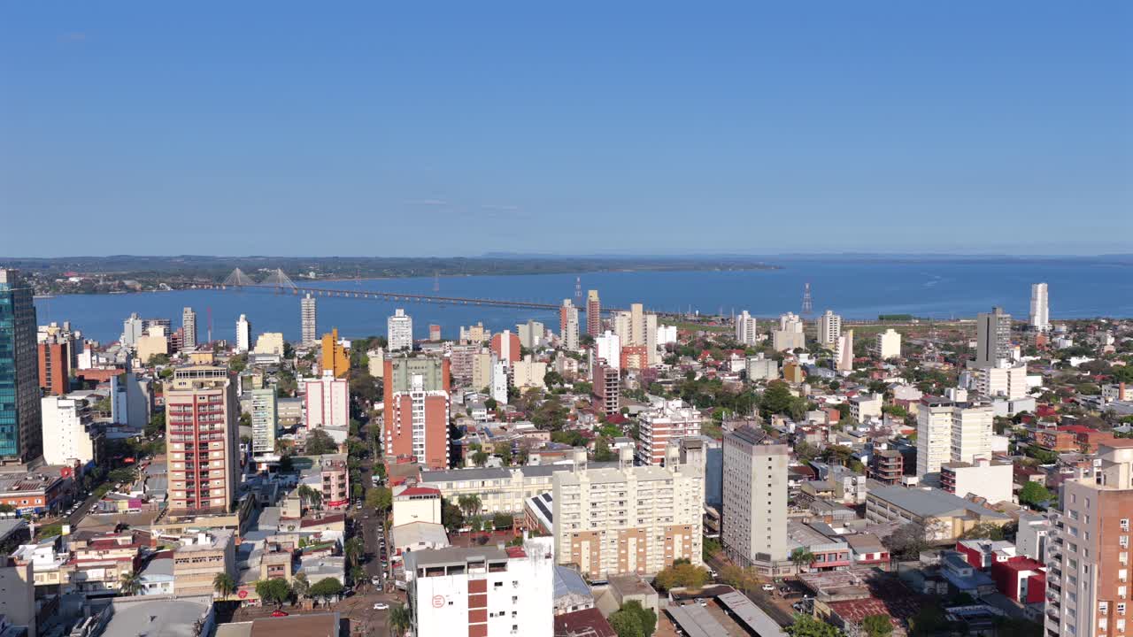 Aerial cityscape of Posadas with the Paraná River, San Roque Gonzalez International Bridge and Paraguay in the background