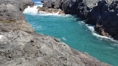 Volcanic-rock-formations-from-cooled-lava-by-the-sea-shore-in-Canary-Islands-archipielago