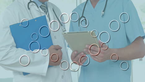 discussing patient information, medical professionals using circular data animation
