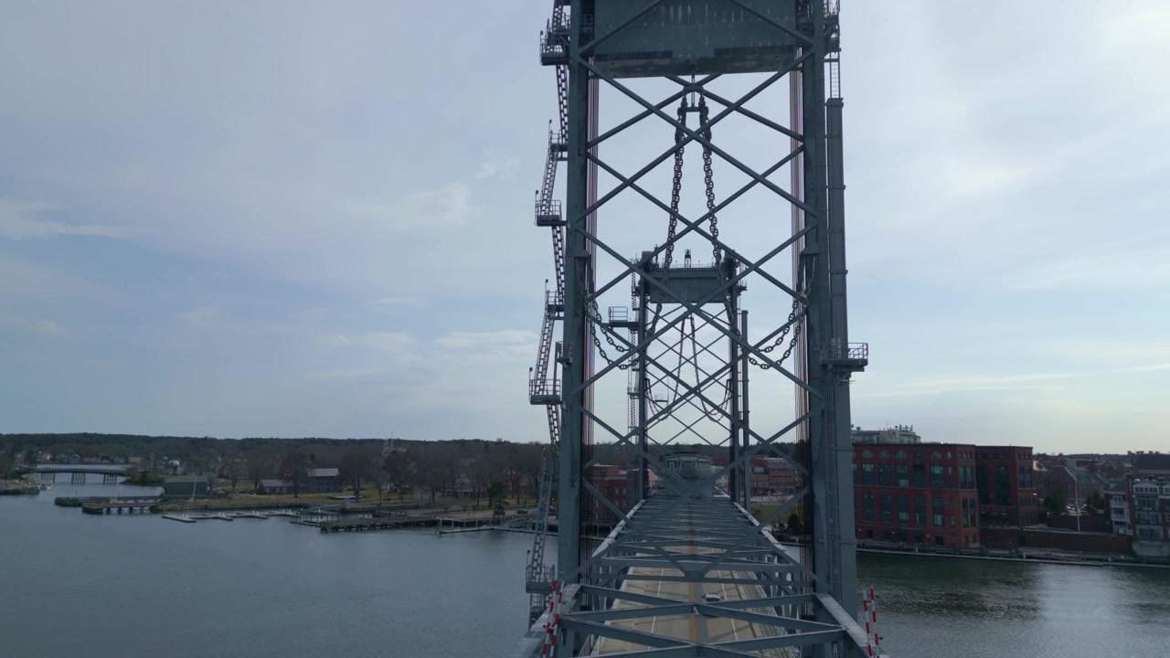 Drone orbits vertical-lift World War I Memorial bridge over Piscataqua river in Portsmouth, U.S.