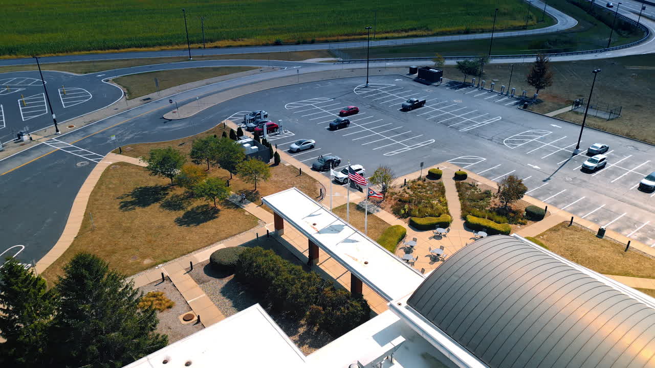 Chicago, USA, 29 June 2025: Aerial drone view showing the highway, rest area, and adjacent green fields with light traffic on the road