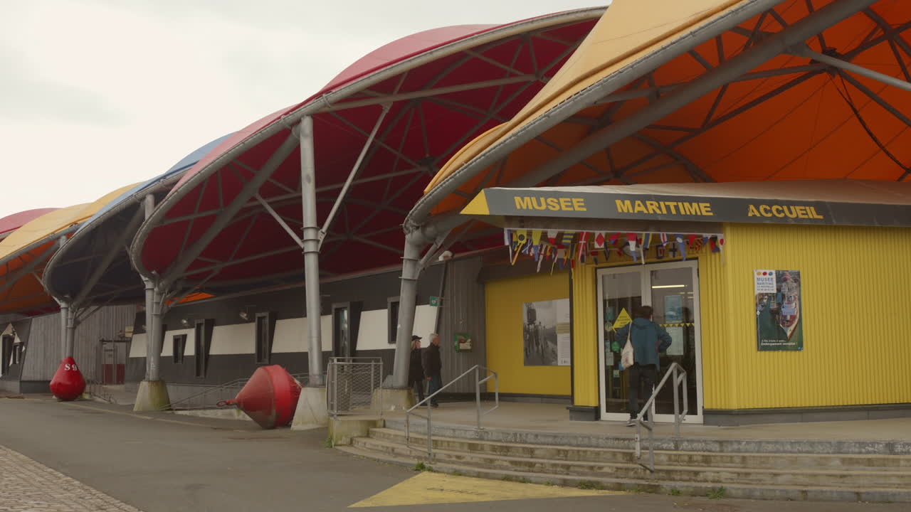 Visitor at the door of the Maritime museum in the city of La Rochelle, France.