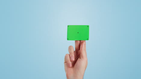 Hands,-green-screen-and-business-card-on-mockup