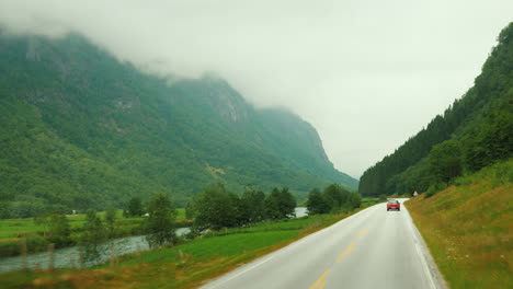 go along the scenic road among the mountains of norway first-person view