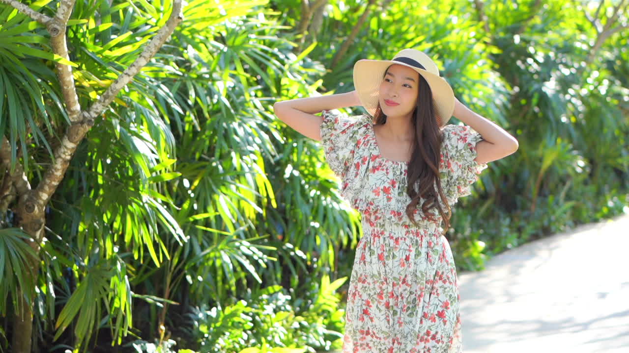 Asian Woman in Long Dress Walking Happily in Sunny Hotel Garden SLOMO