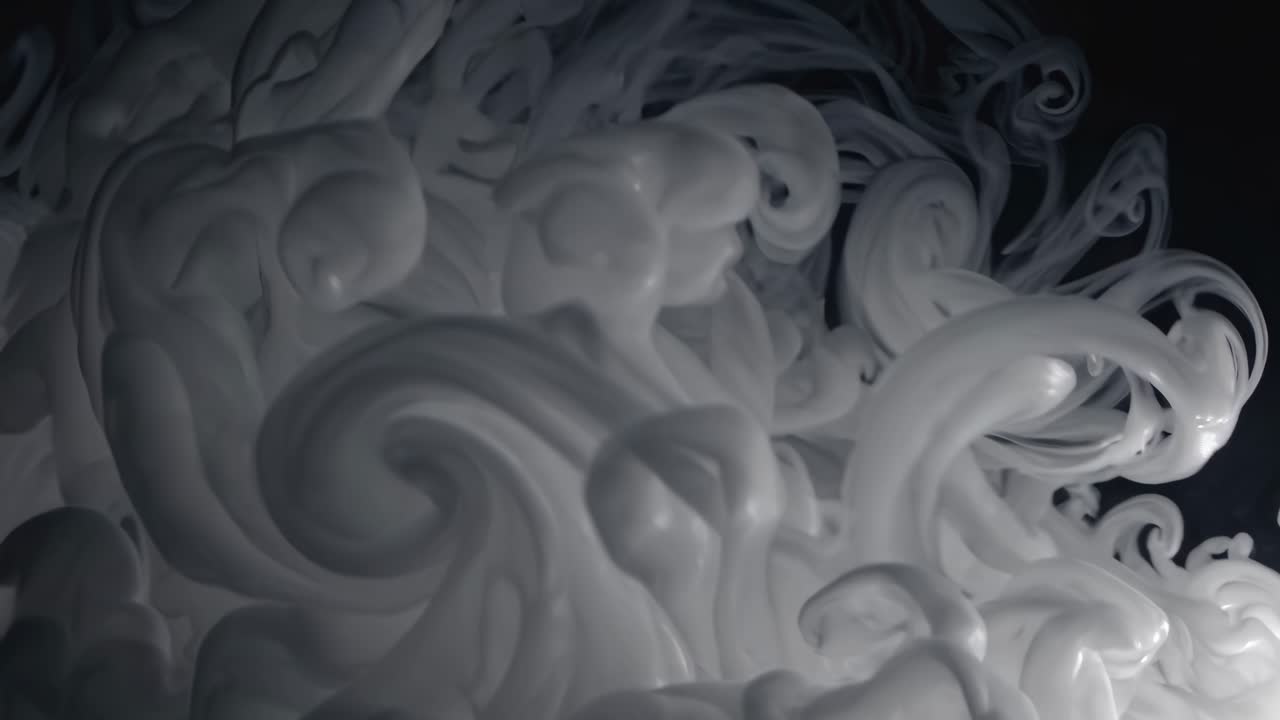 A mesmerizing video of swirling white smoke captured in close-up, creating an abstract, ethereal